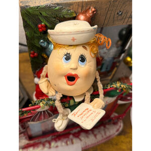 Nurse Egg on a seat red hair red lips shoes and shoestrings!